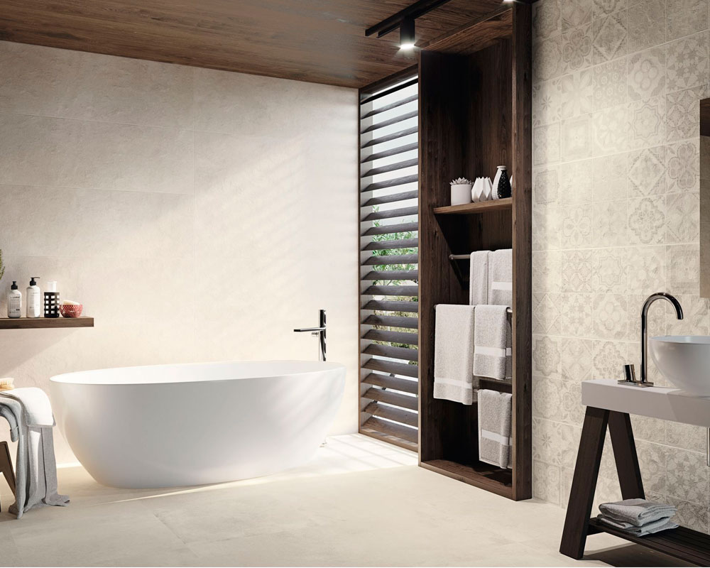 Sala de baño con revestimiento y pavimento de porcelánico efecto cemento.