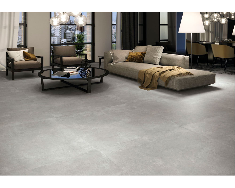 Salón pavimentado con porcelánico efecto cemento
