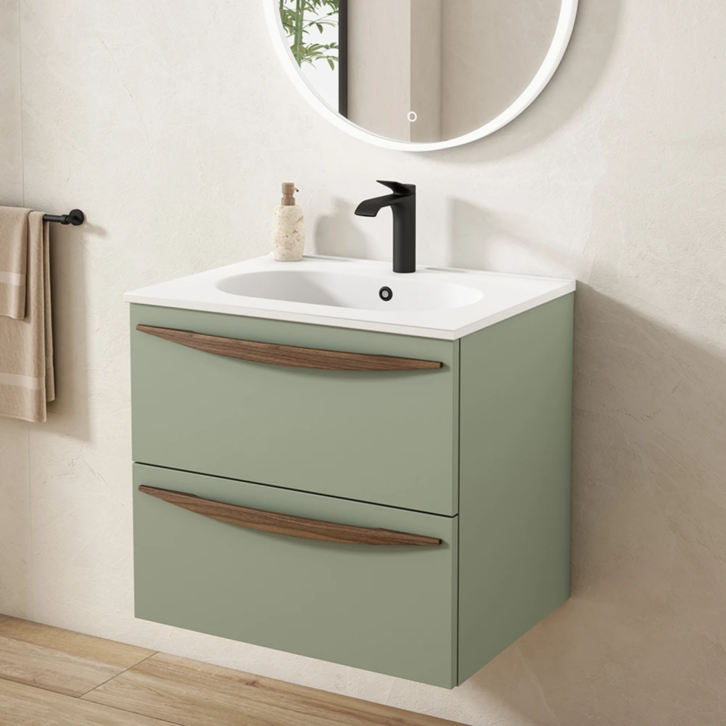 Baño minimalista con lavabo encastrado en moderno mueble de baño en color verde menta con tiradores de madera y grifería de baño negra